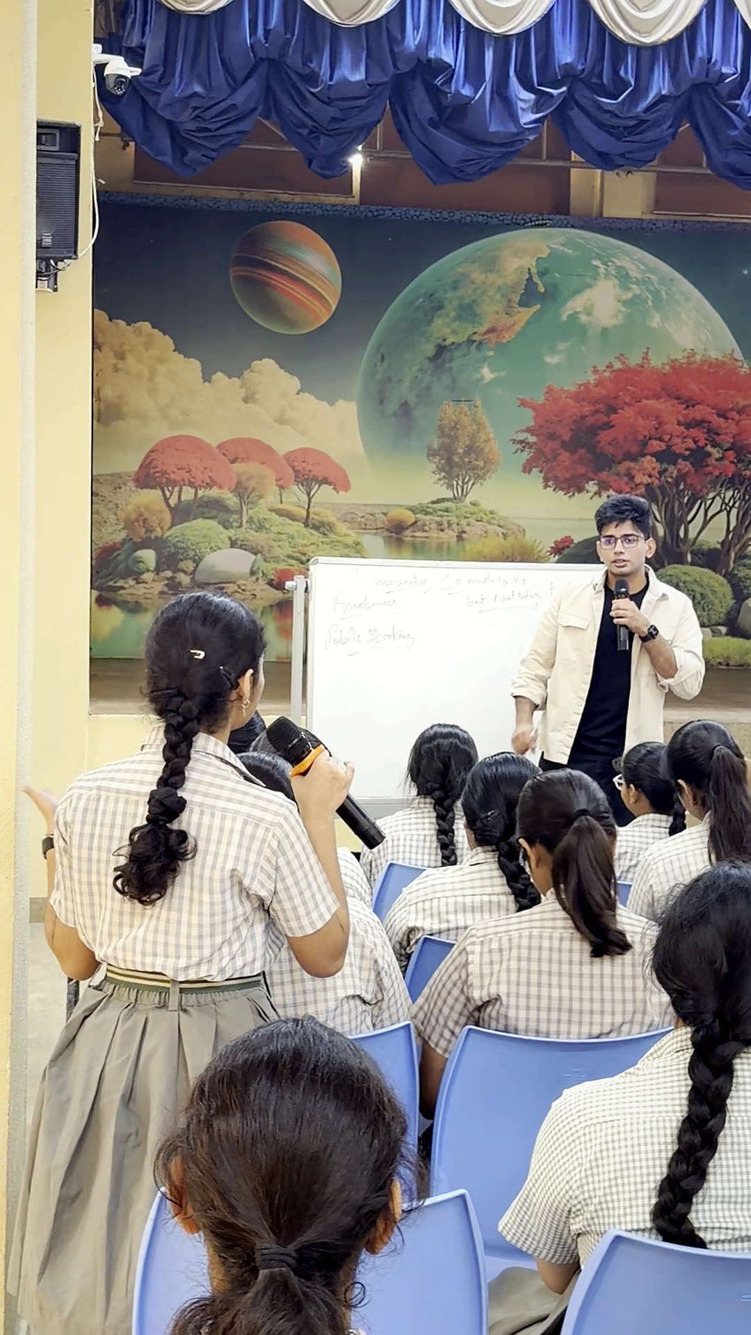 Raman listening as a student speaks in a workshop